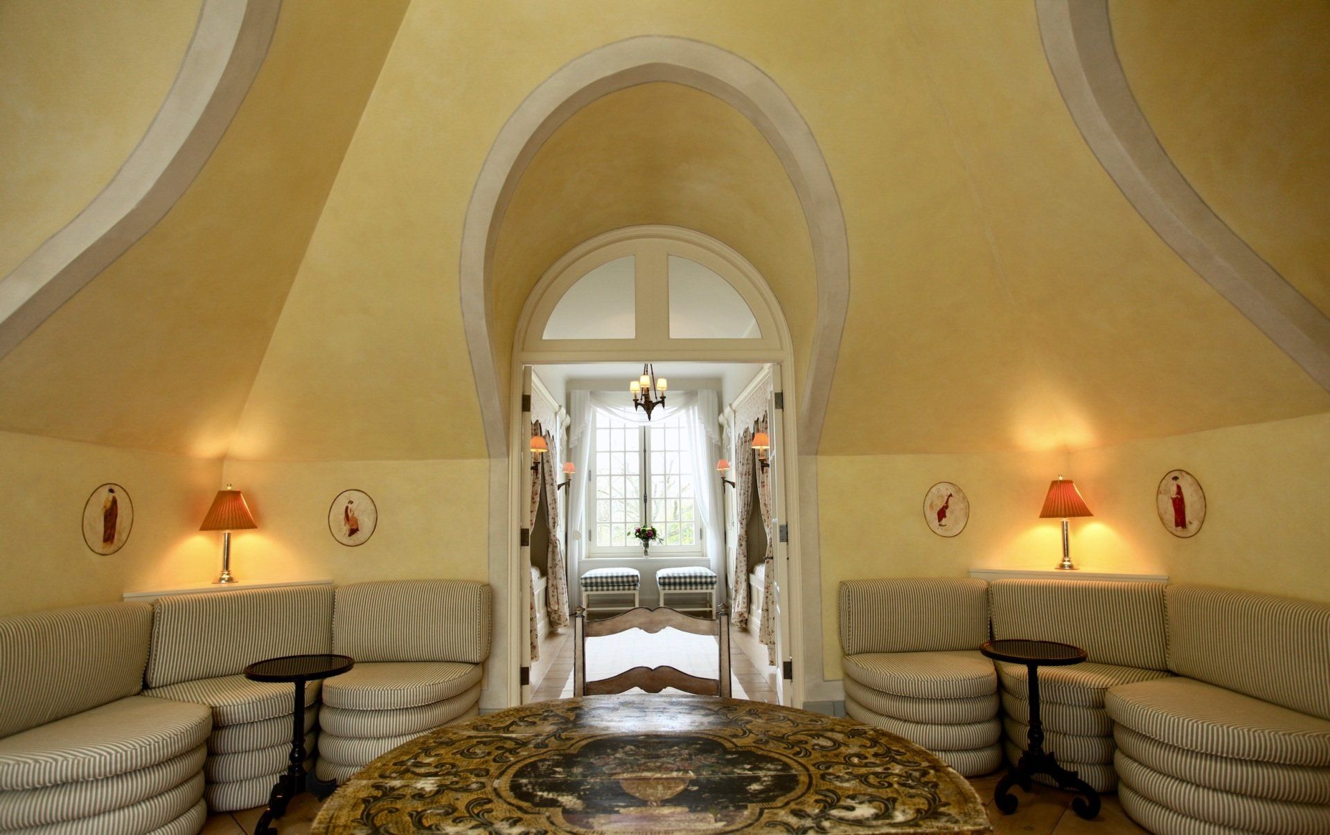 A living room with a mosaic floor and a couch