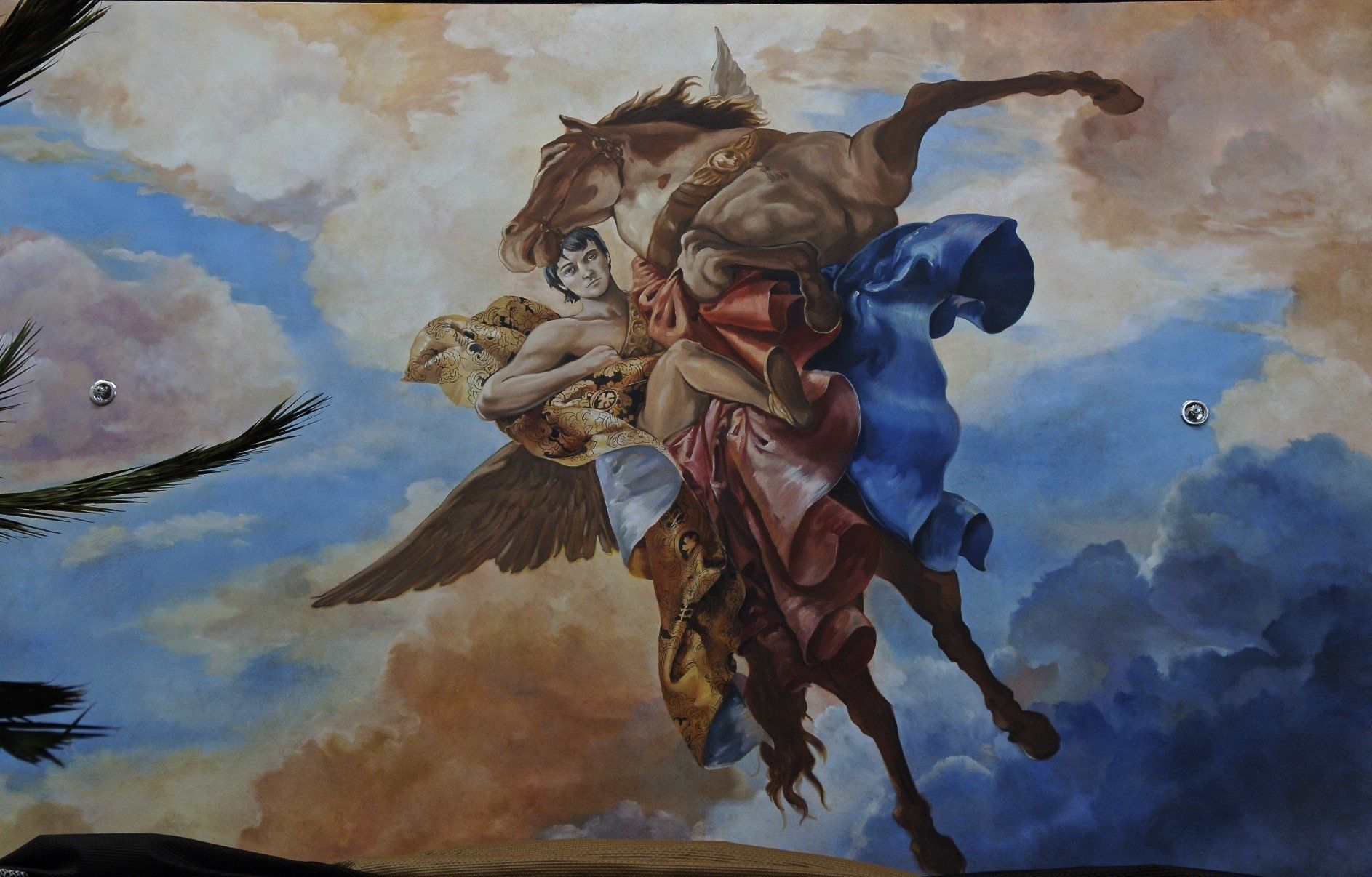 A painting of a man riding on the back of a horse