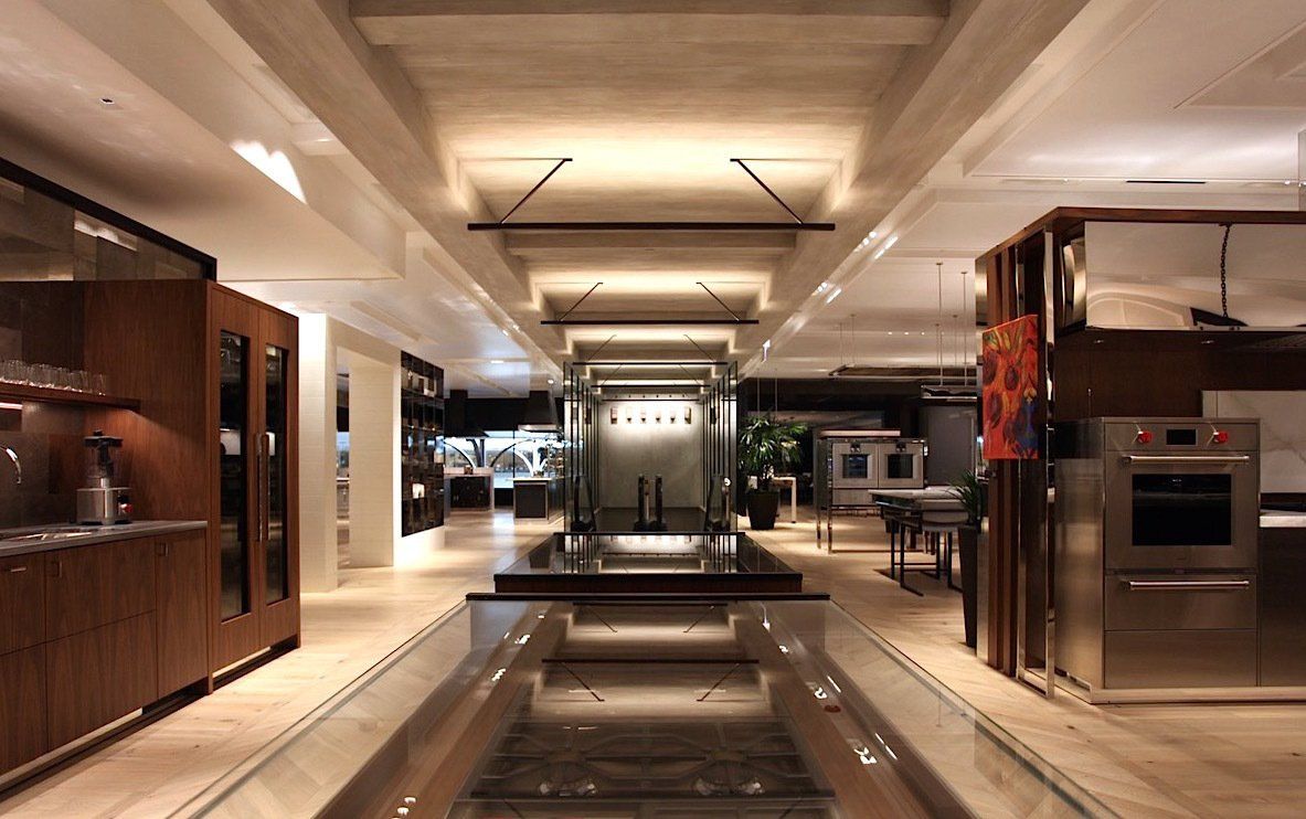 A kitchen with stainless steel appliances and wooden cabinets