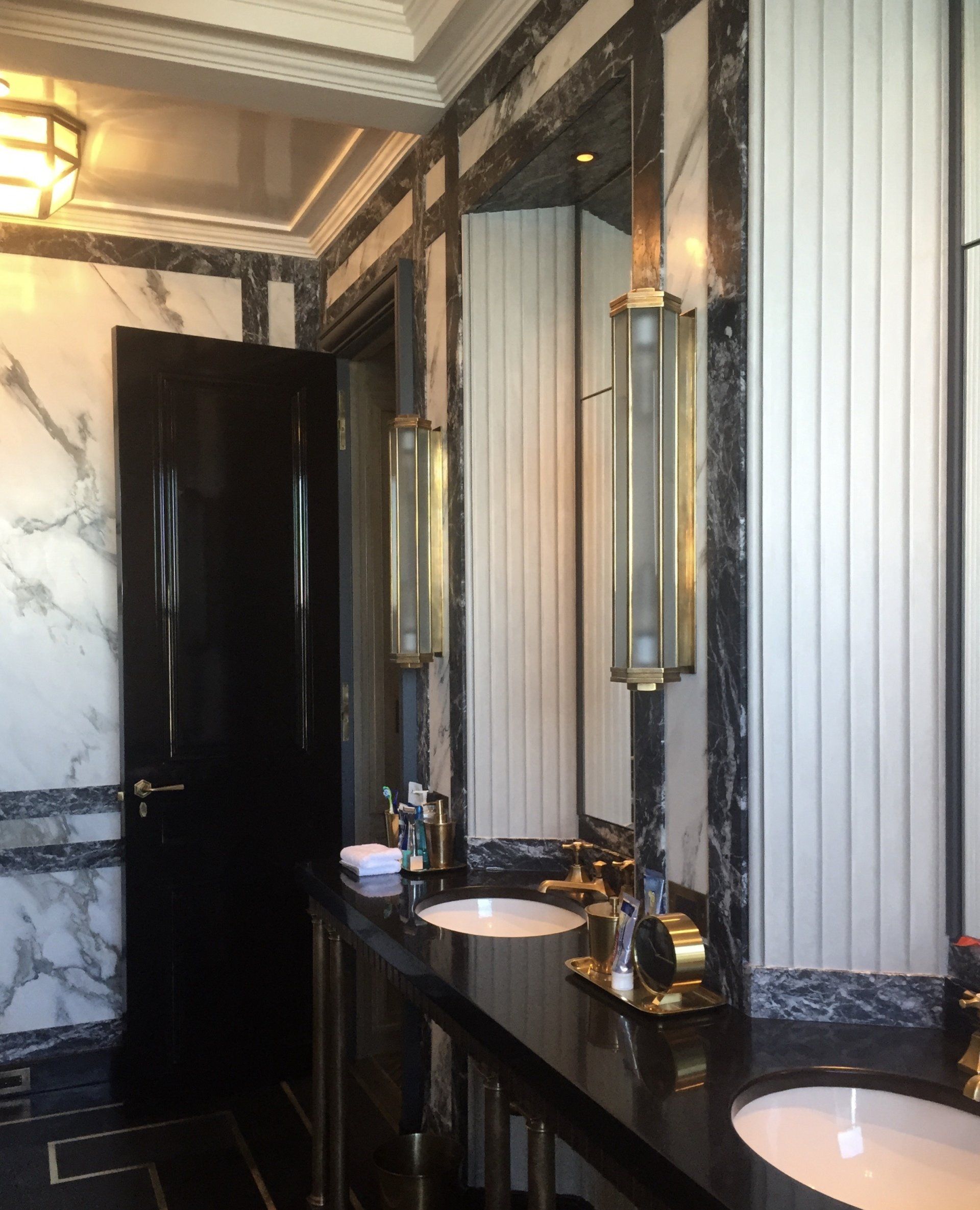 A bathroom with two sinks and two mirrors