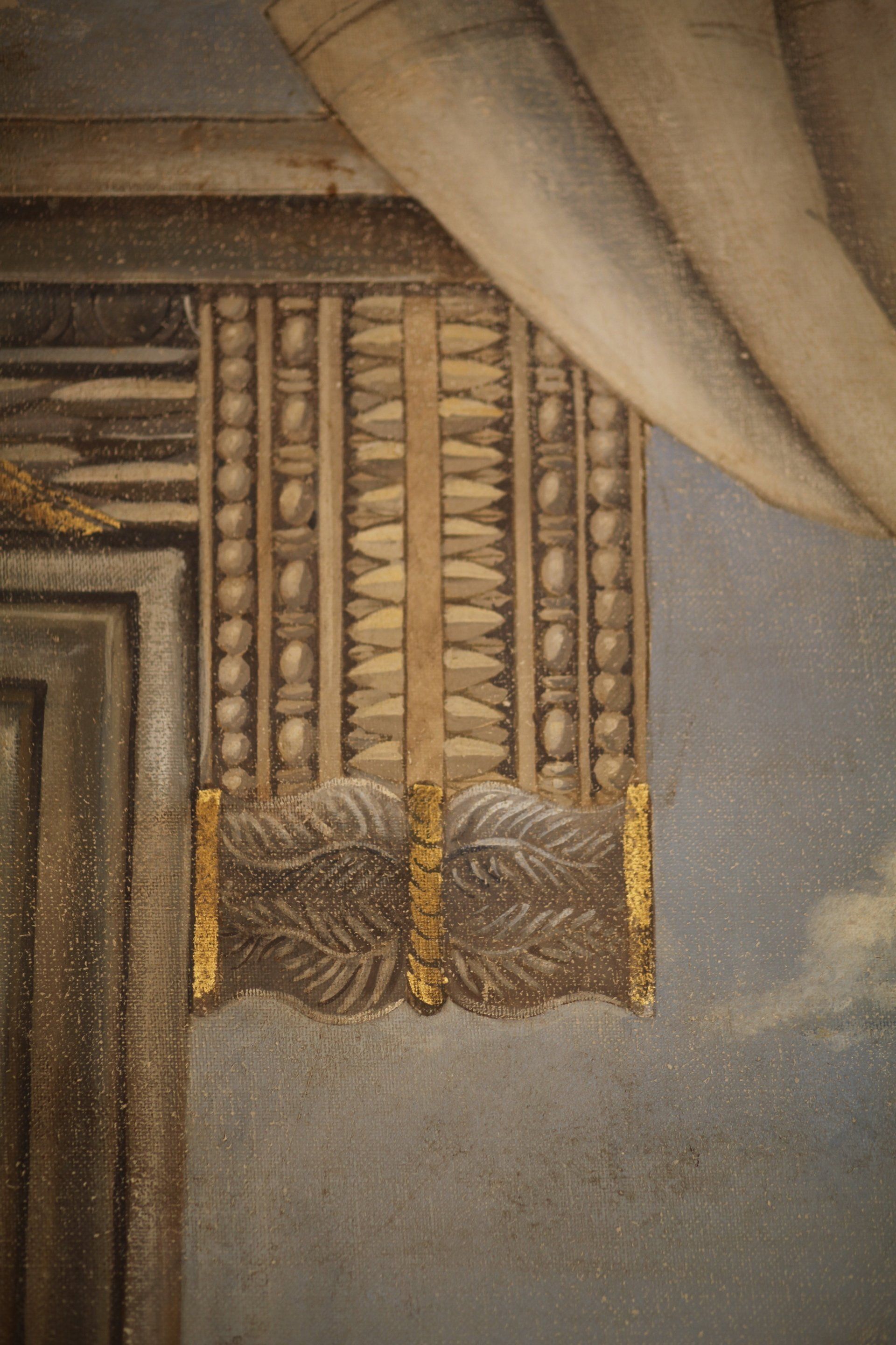 A close up of a painting on a wall with a curtain hanging from it.