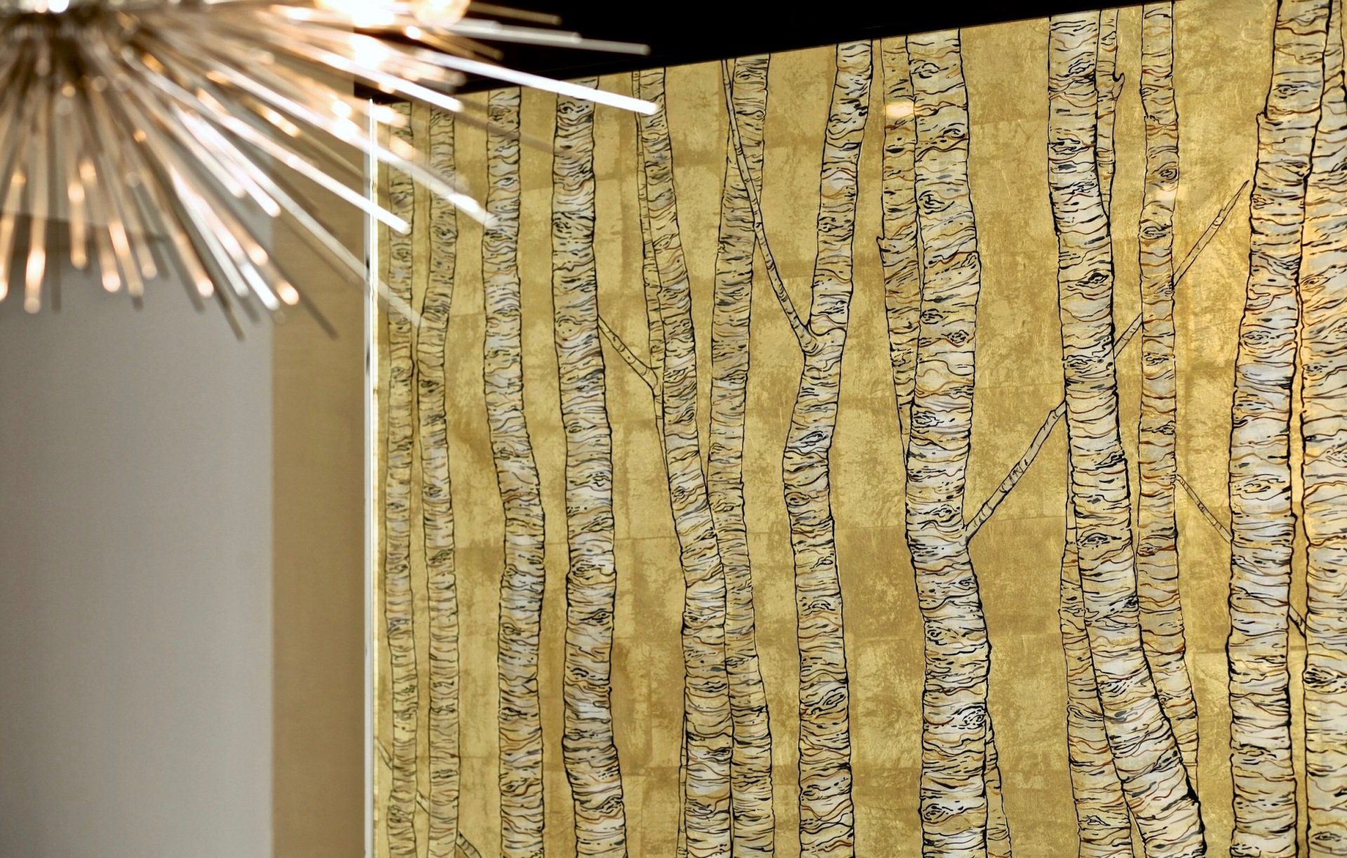 A wall with a painting of trees on it