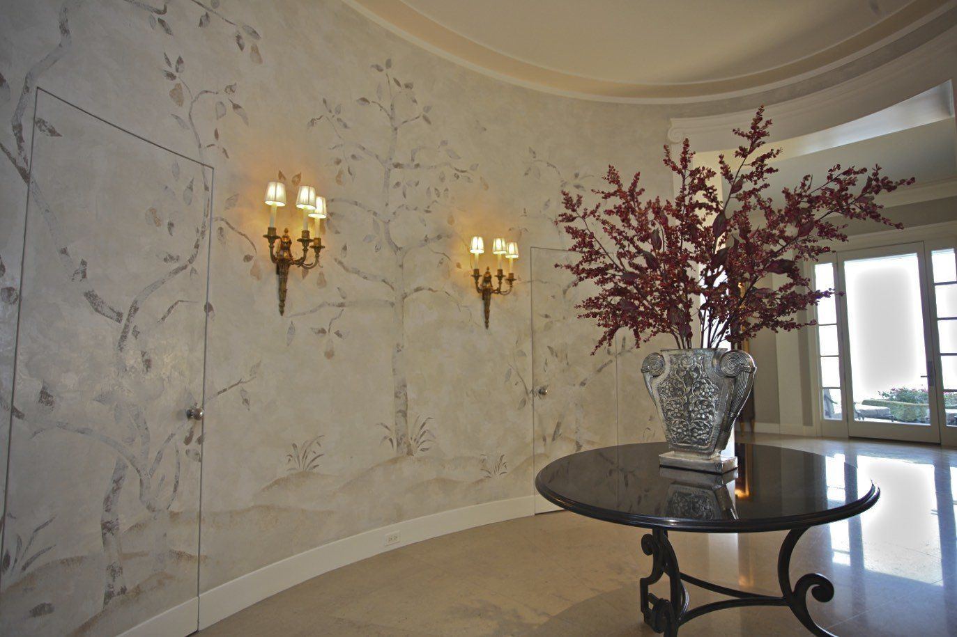 A round table with a vase of flowers on it