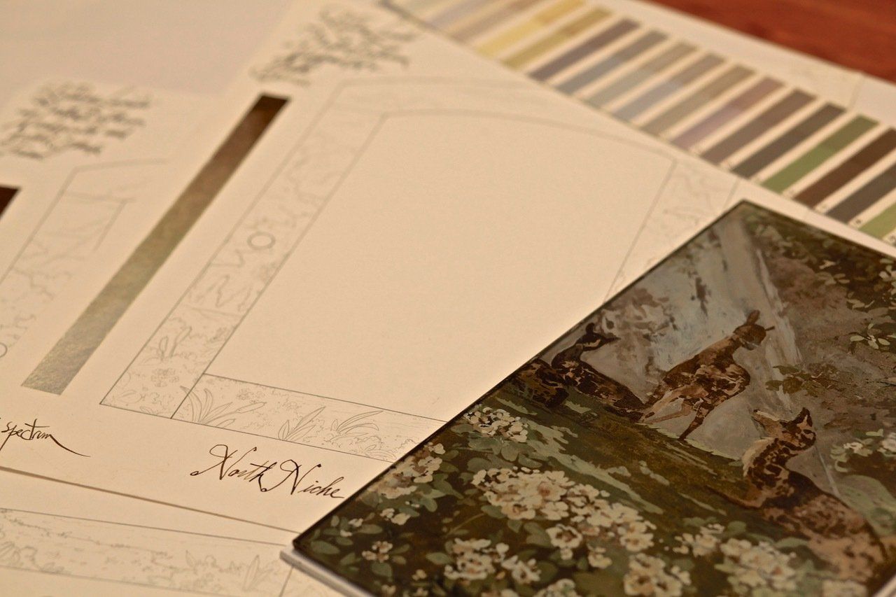 A bunch of cards are sitting on top of each other on a table.