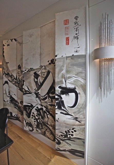 A painting on a wall with chinese writing on it