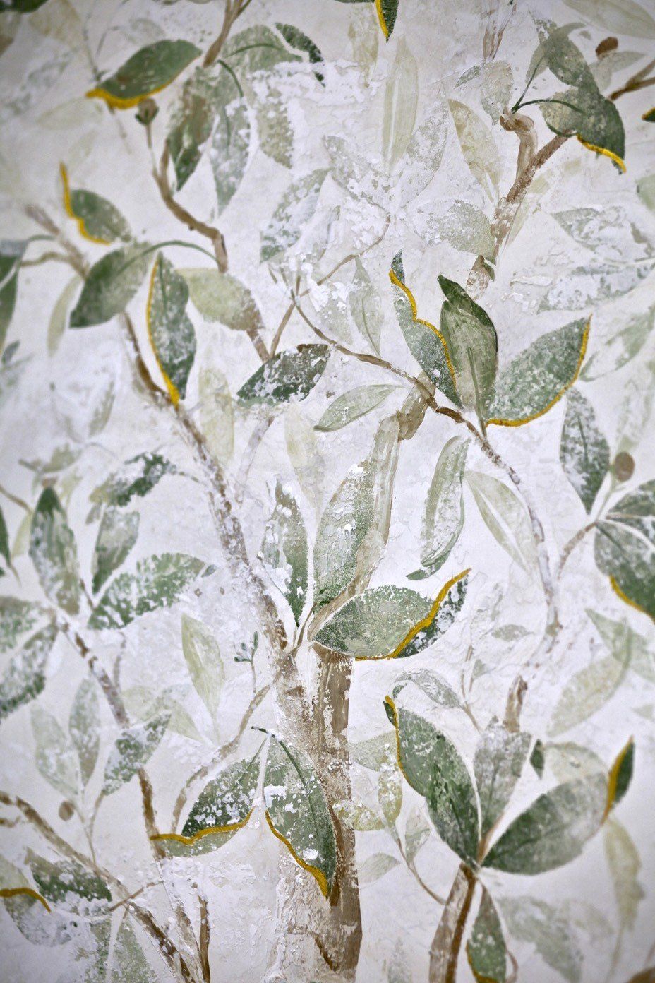 A close up of a painting of a tree with green leaves on a white background.