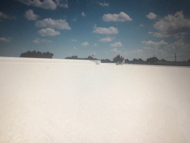 White Roof— Cedar Valley, IA — Raber Roofing Systems LLC.