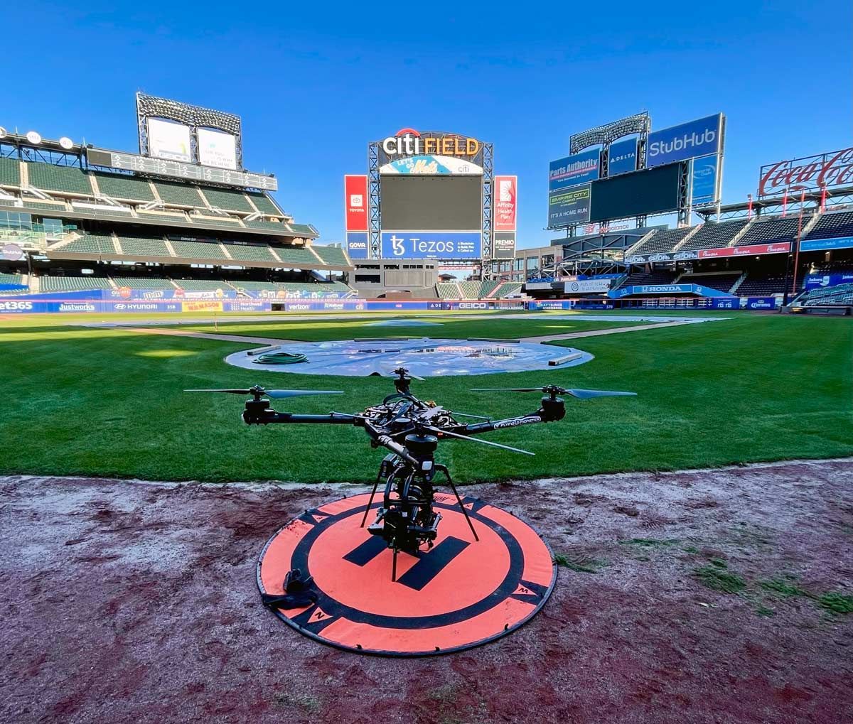 A drone is sitting on a landing pad at citi field