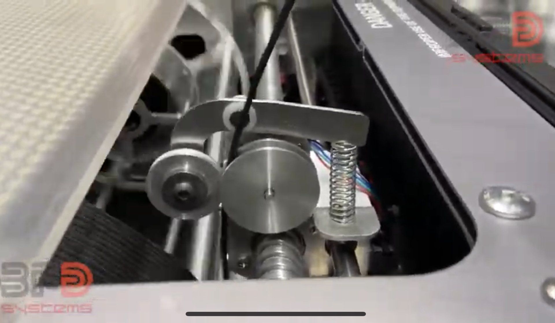 A close up of a car engine with the hood open.