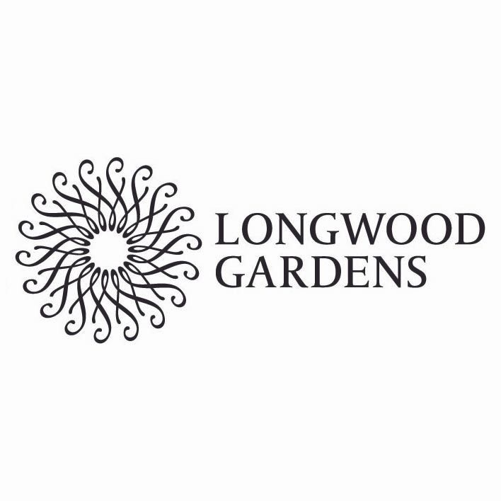 A black and white logo for longwood gardens with a sun in the middle.