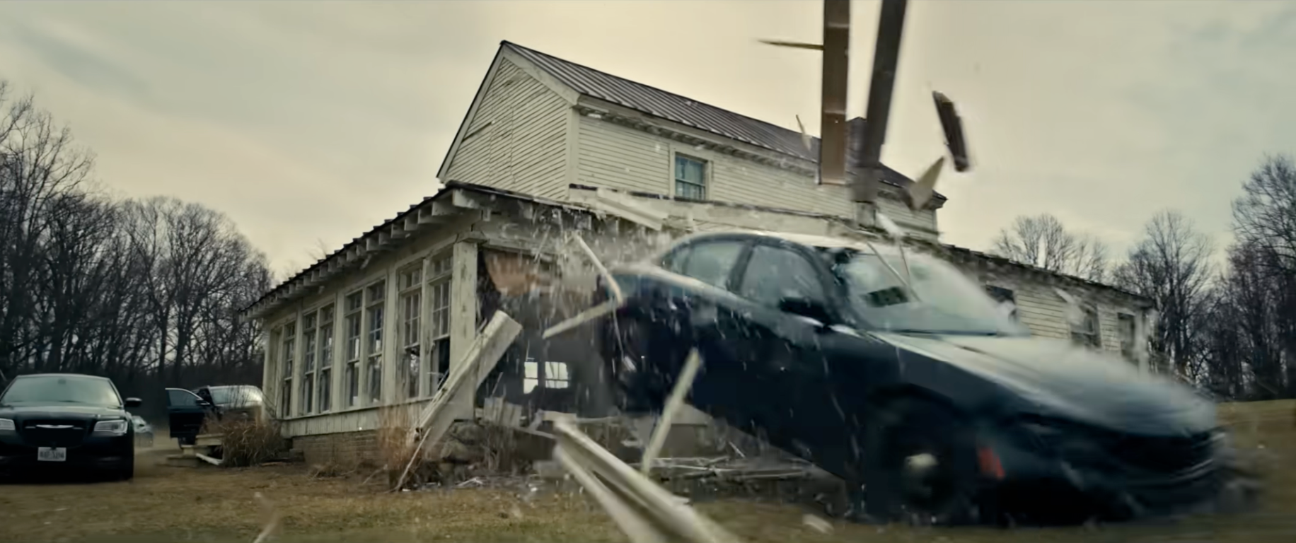 car smashing through a building from Disclosure Day movie