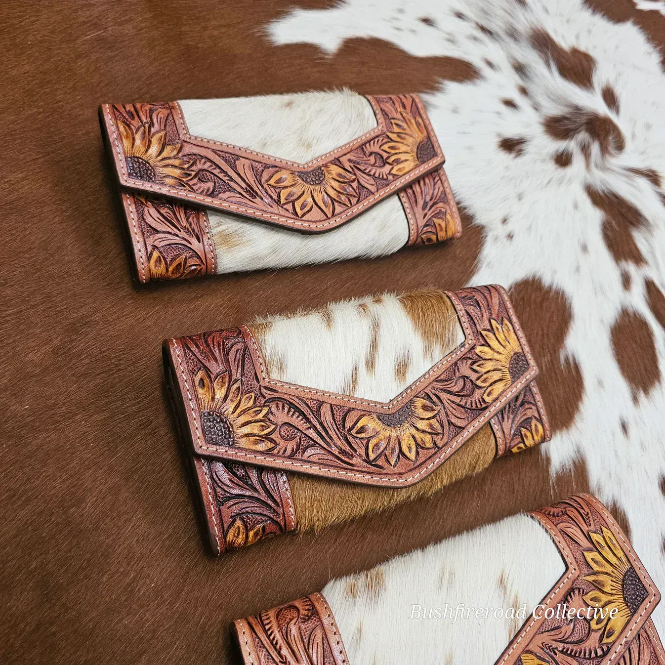 Three Western-style Wallets On A Cowhide Rug — Bushfire Road Collective in Mareeba ,QLD