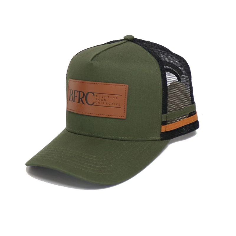 Green Trucker Hat With Brown Leather Patch, Black Mesh Backing, And Orange Stripe — Bushfire Road Collective in Mareeba ,QLD