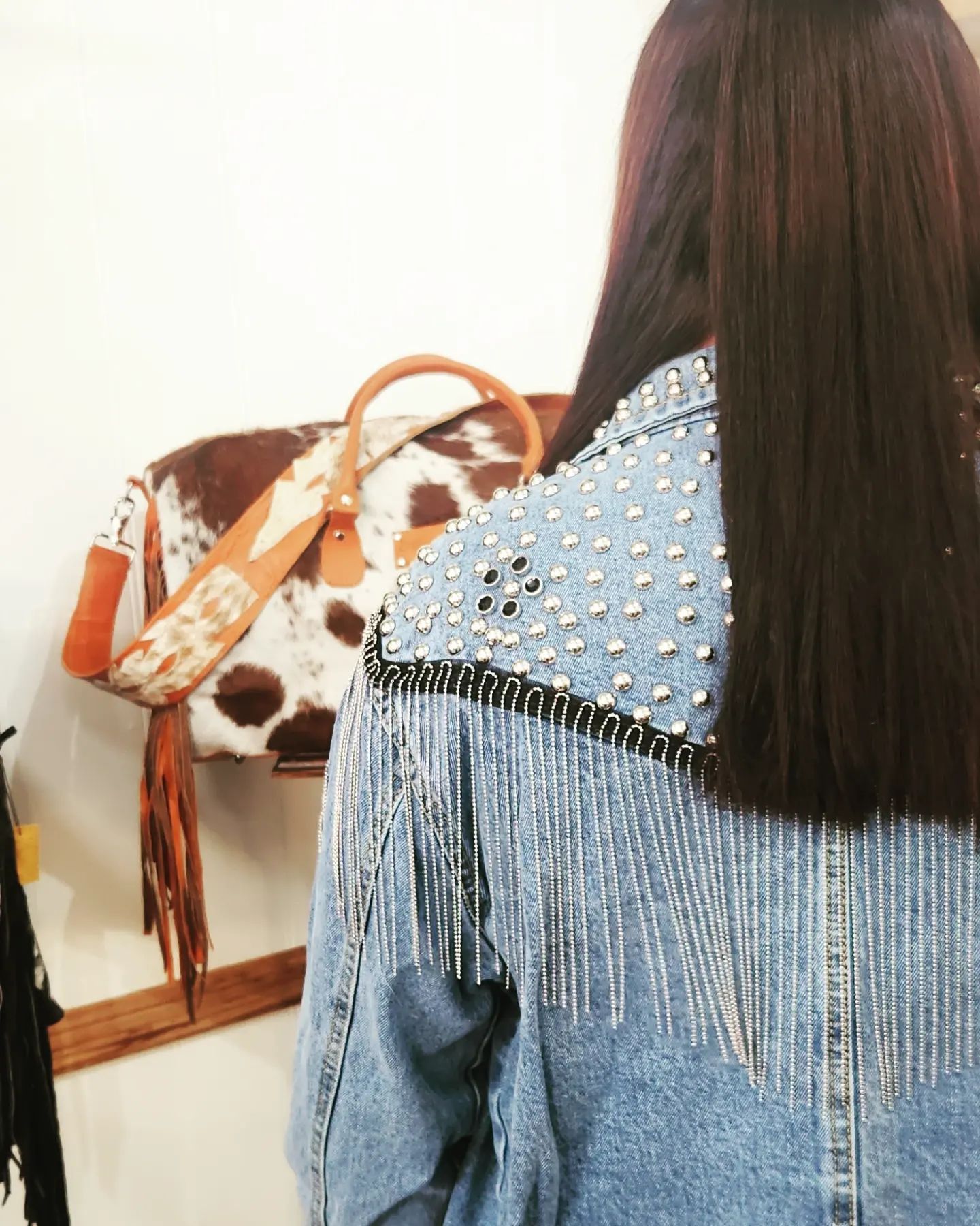 Woman With Dark Hair Wearing Denim Jacket With Silver Studs — Bushfire Road Collective in Mareeba ,QLD