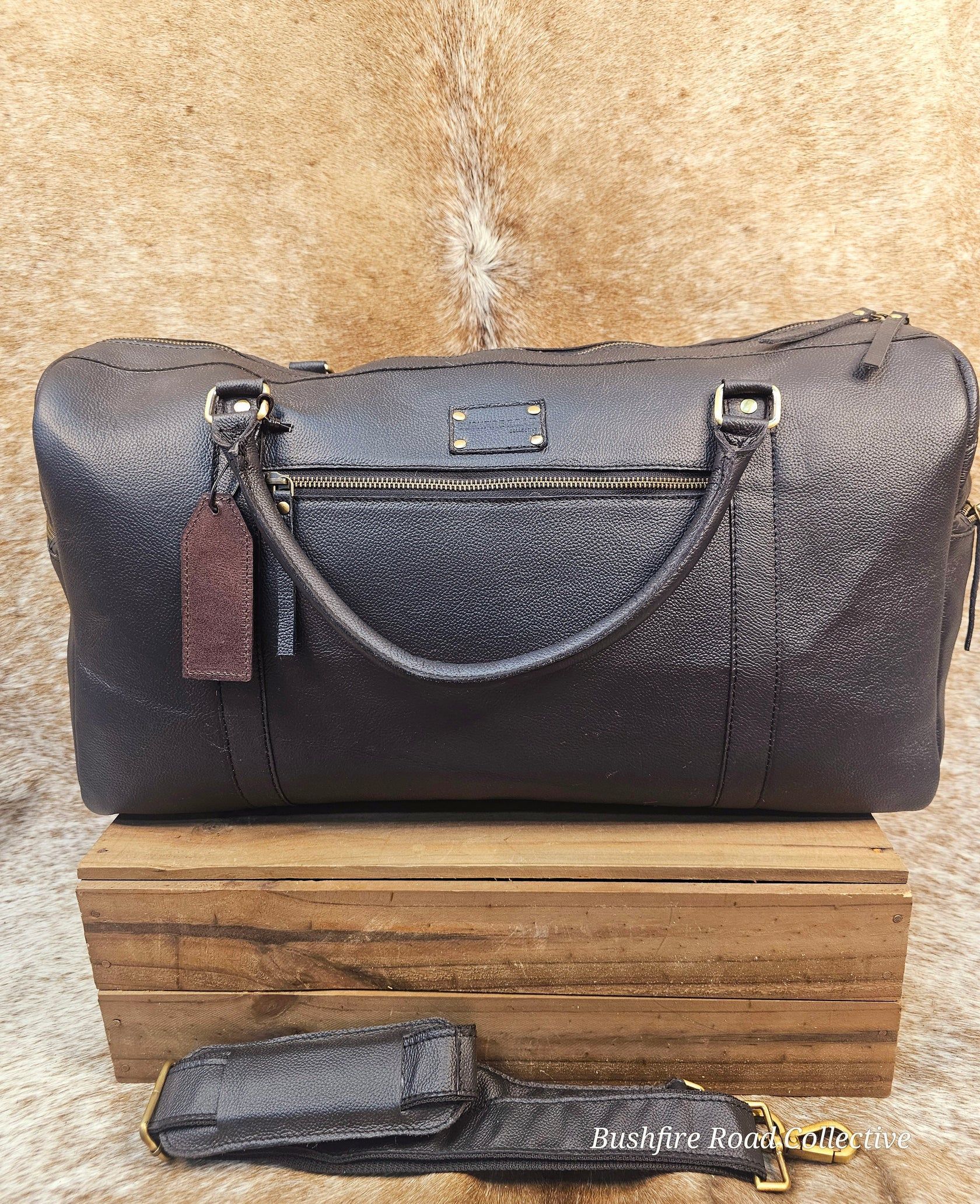 Dark, Textured Handbag With Matching Shoulder Strap On A Wooden Box, Against A Neutral Backdrop — Bushfire Road Collective in Mareeba ,QLD