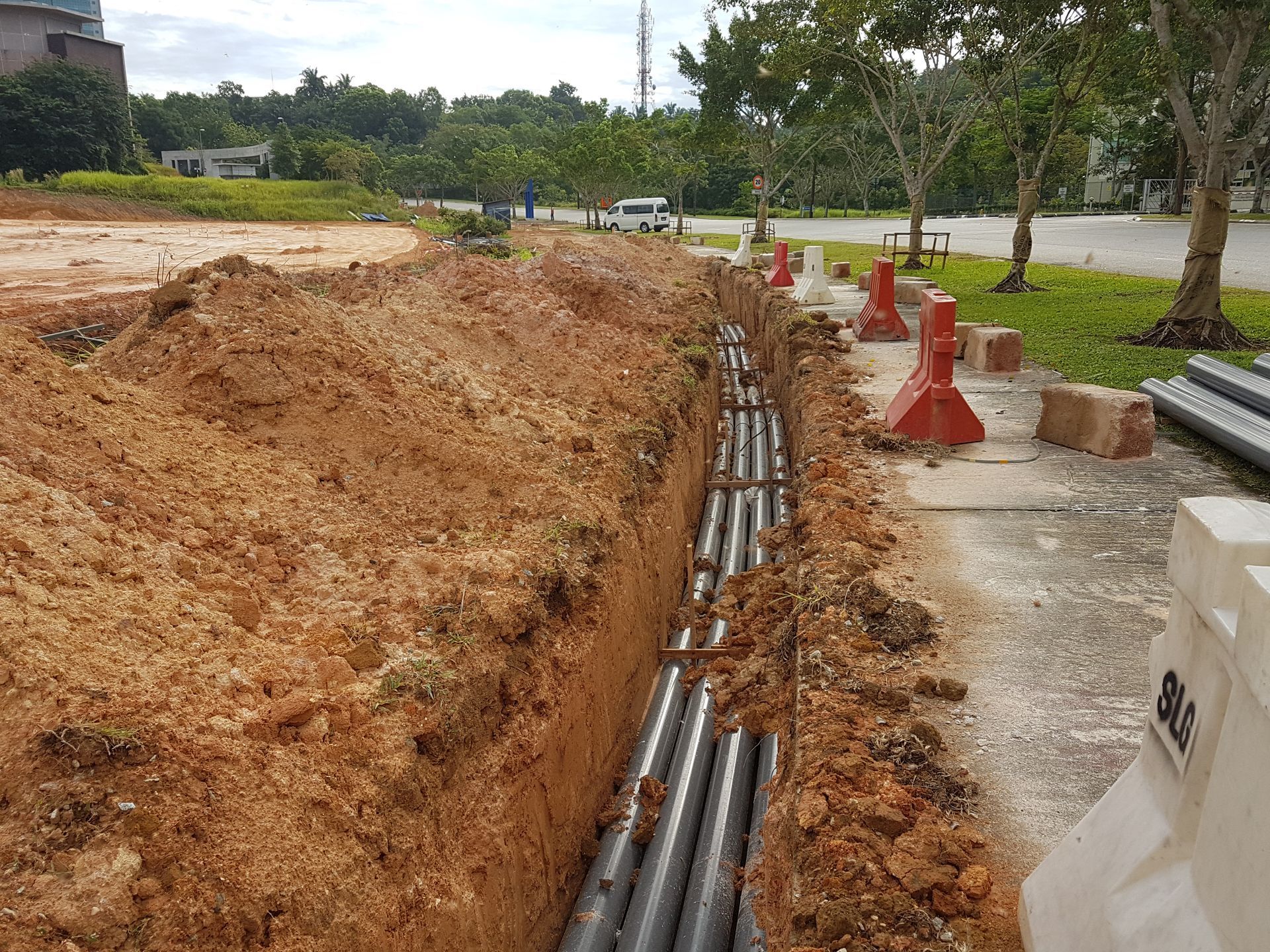 At the construction site, pits were filled with underground utility and service piping.