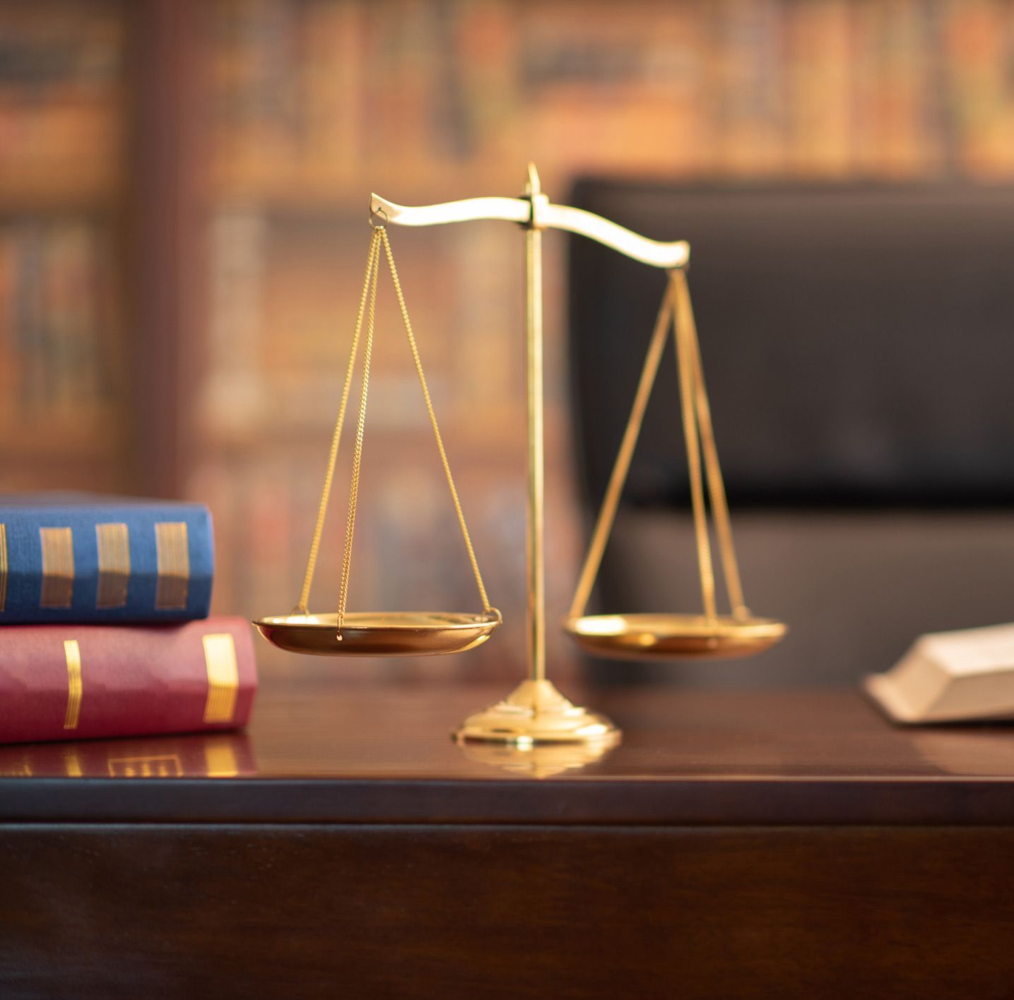 A Scale of Justice on a Desk A Scale of Justice on a Desk