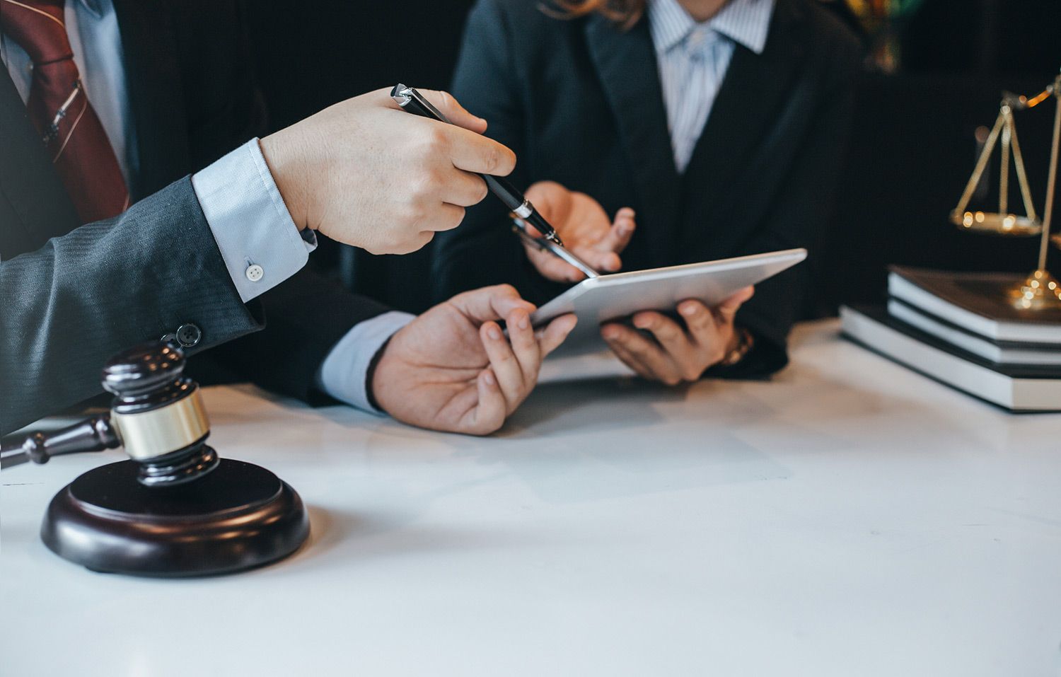 Attorney and Client Looking at a Tablet Attorney and Client Looking at a Tablet