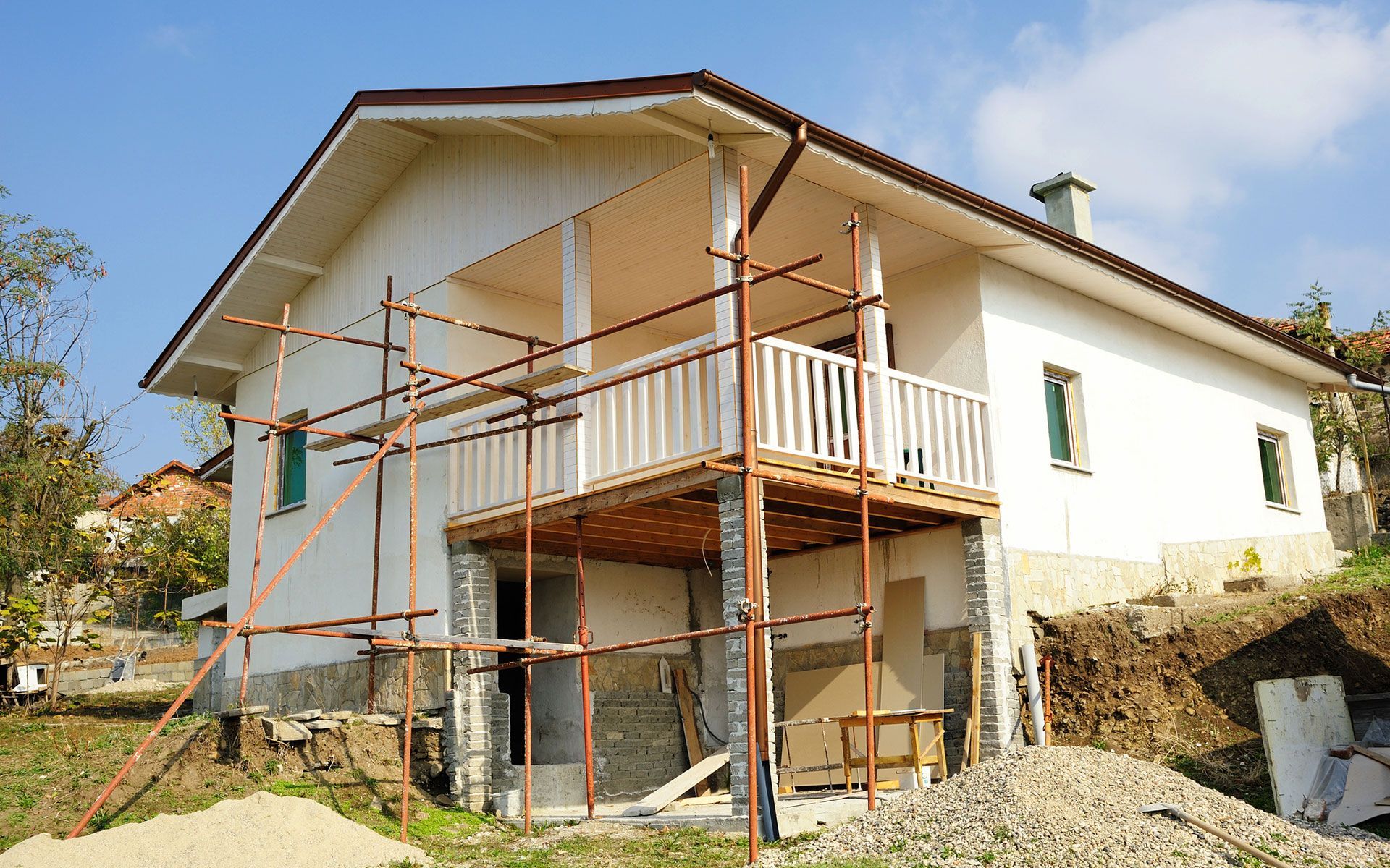 A house under construction with scaffolding around it