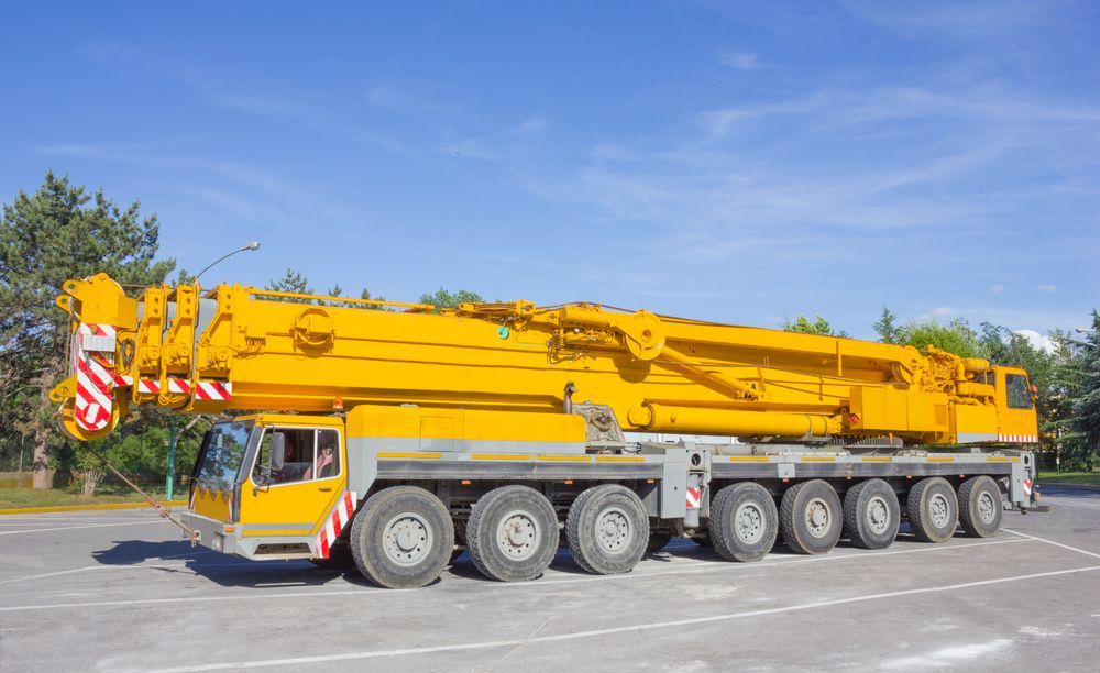 Long Yellow Mobile Crane on a Road Under a Blue Sky — Barkly Hire in Cloncurry, QLD