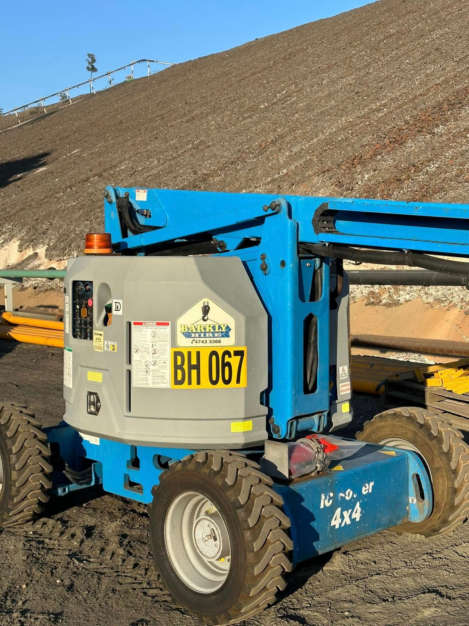 Very Tall Tower With a Yellow Flag on Top of It — Barkly Hire in Ryan, QLD
