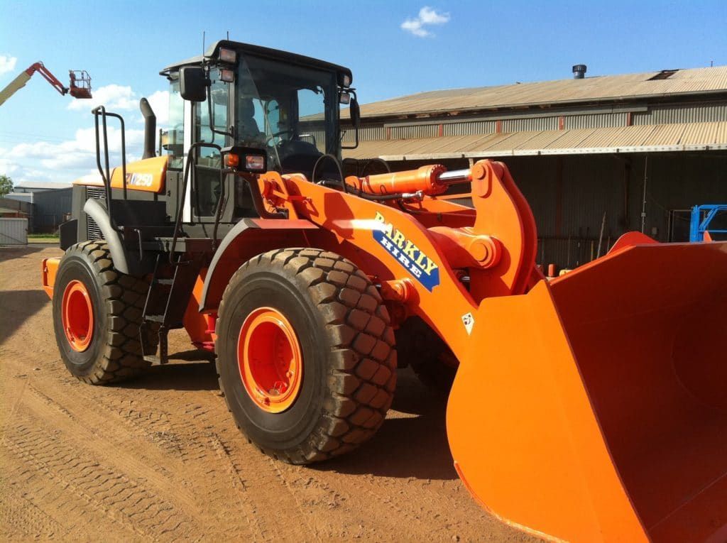 Large Orange Army Tractor is Parked on a Dirt Road — Barkly Hire in Ryan, QLD