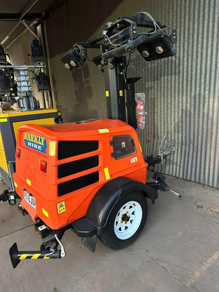 Large Orange Vehicle is Parked in Front of a Building — Barkly Hire in Ryan, QLD