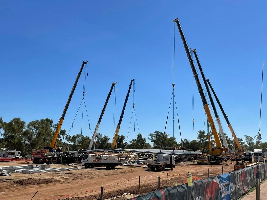 Group of Cranes Are Working on a Construction Site — Barkly Hire in Ryan, QLD