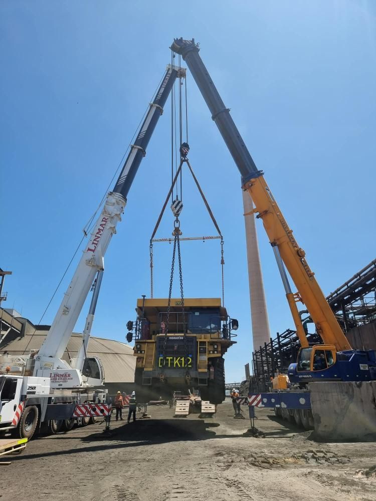 Large Truck is Being Lifted by Two Large Cranes — Barkly Hire in Ryan, QLD