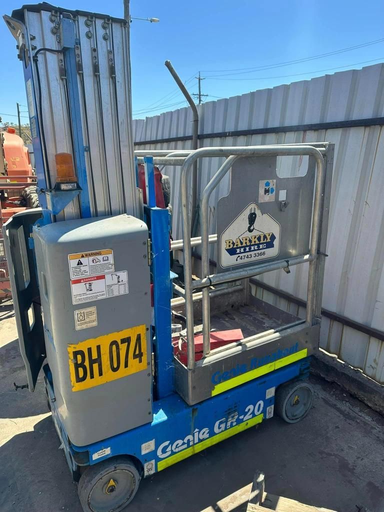 Genie Lift is Parked in Front of a Fence — Barkly Hire in Ryan, QLD