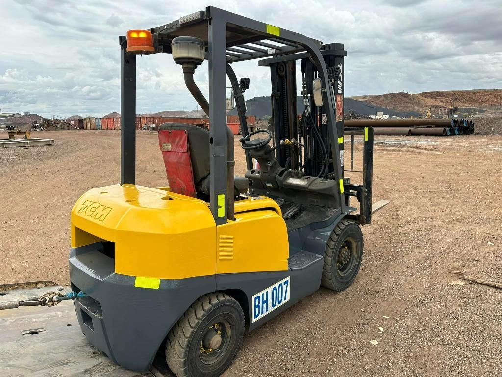 Yellow and Gray Forklift is Parked in a Dirt Field — Barkly Hire in Ryan, QLD