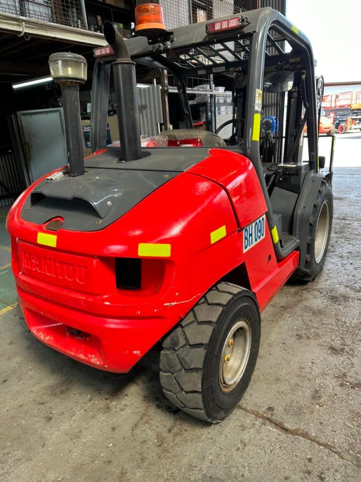 Red Forklift is Parked in a Parking Lot — Barkly Hire in Ryan, QLD