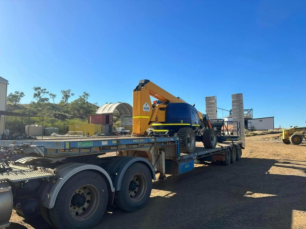 Truck is Carrying a Crane on a Flatbed Trailer — Barkly Hire in Ryan, QLD