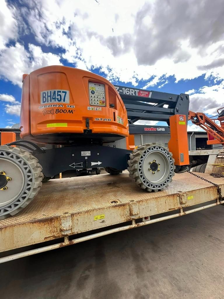 Large Orange Crane is Sitting on Top of a Trailer — Barkly Hire in Ryan, QLD