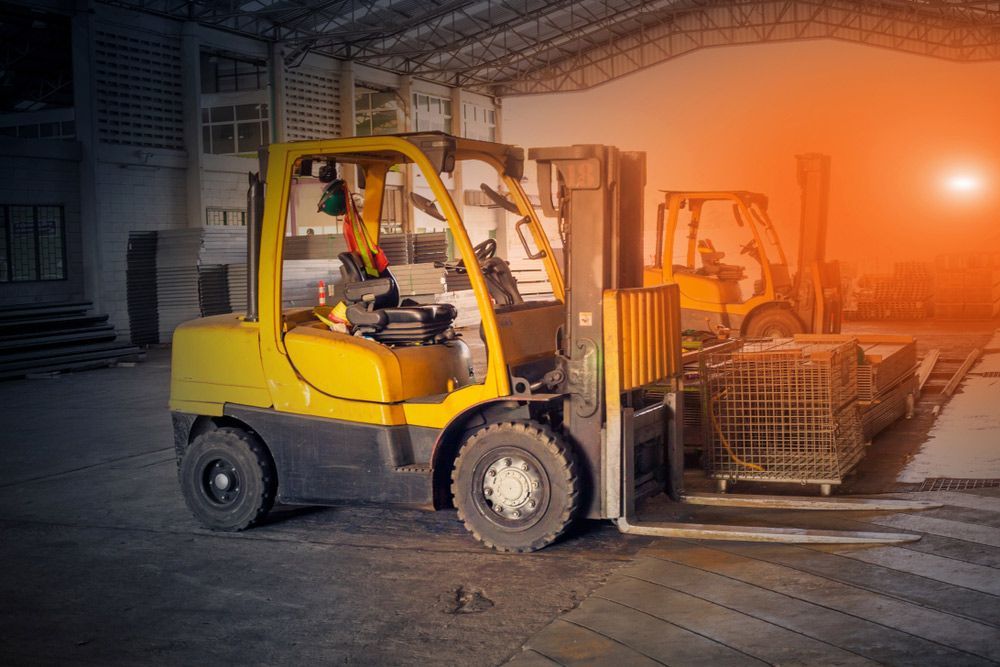 Yellow Forklift is Loading Crates in a Warehouse — Barkly Hire in Ryan, QLD