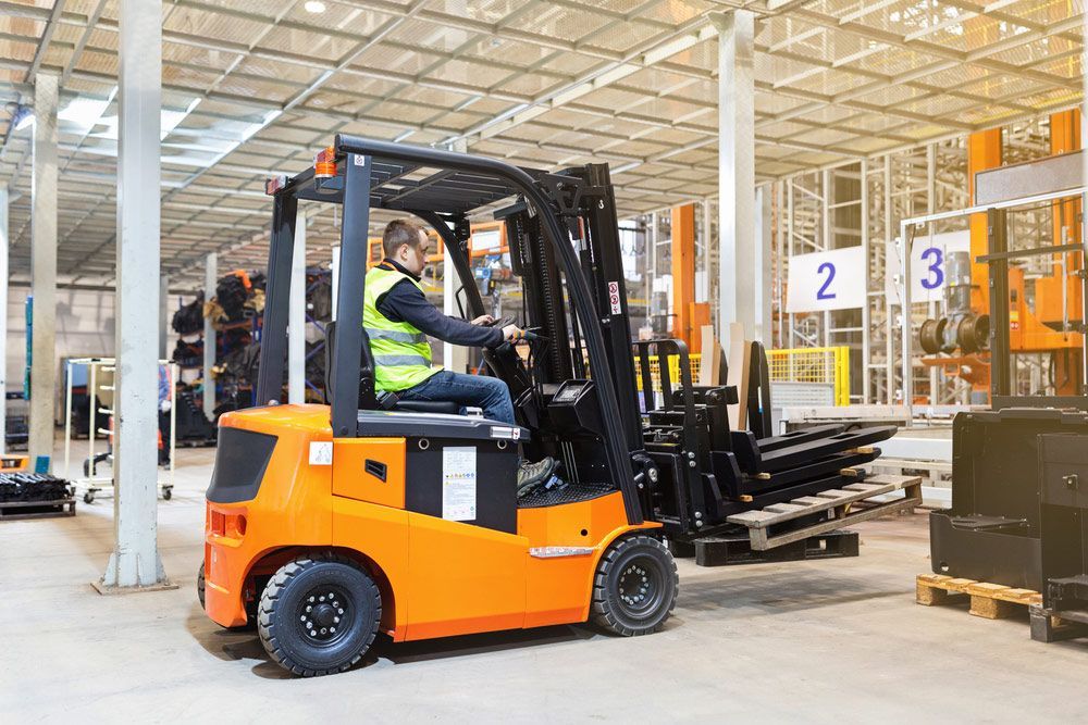 Man is Driving a Forklift in a Warehouse — Barkly Hire in Ryan, QLD