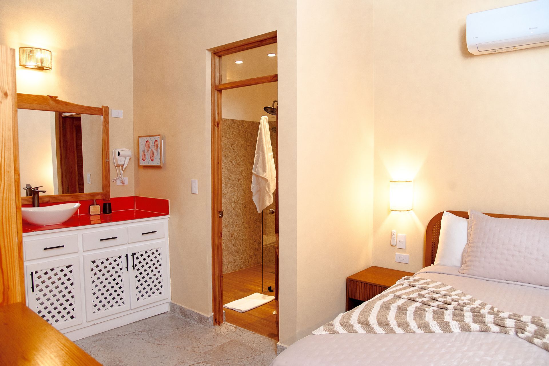 A bedroom with two beds and a ceiling fan.