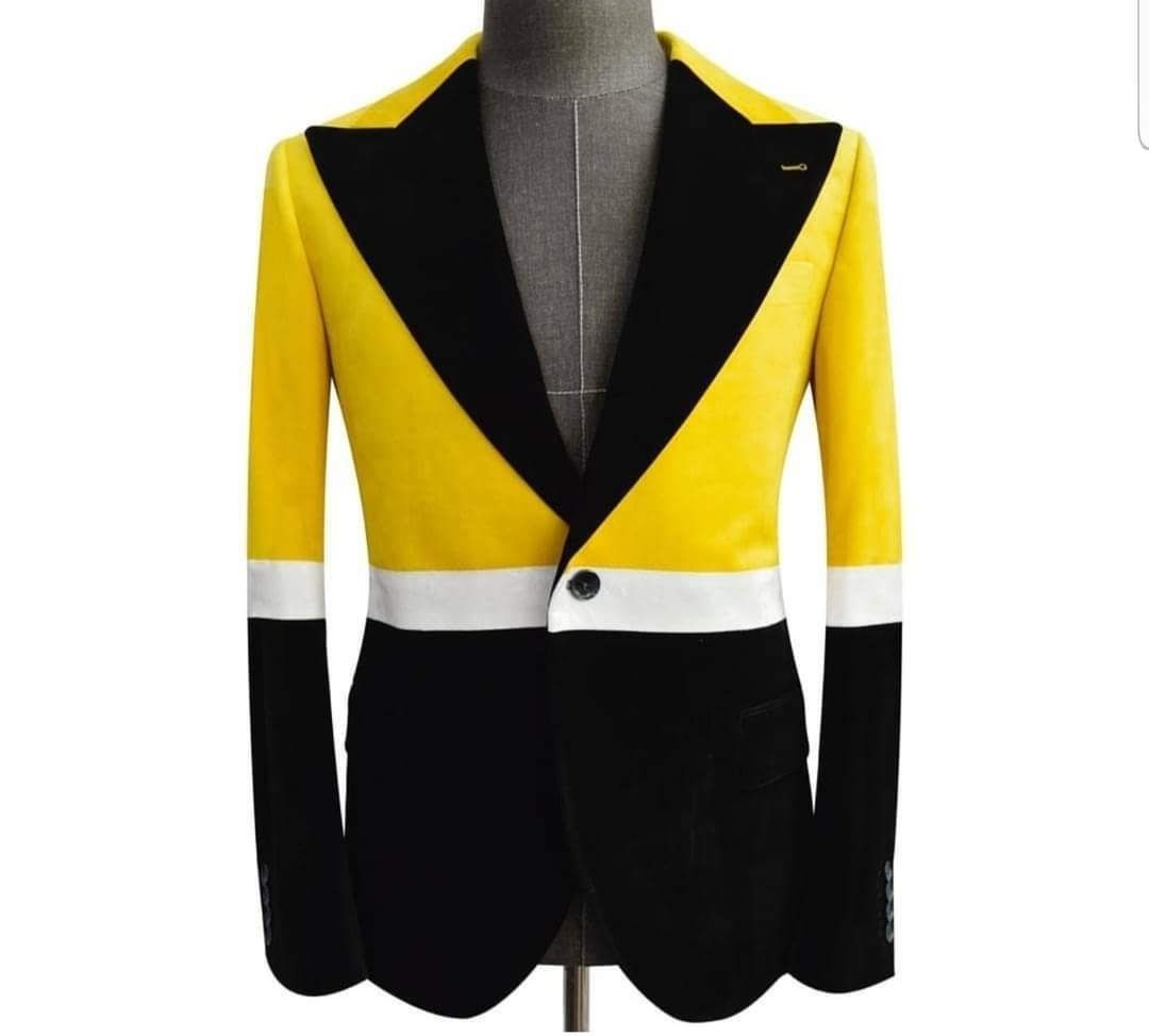 A yellow black and white jacket is on a mannequin