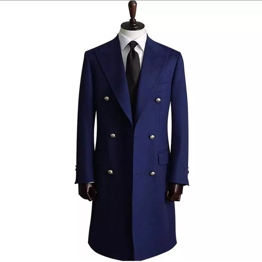 A man is adjusting his jacket with his hands.