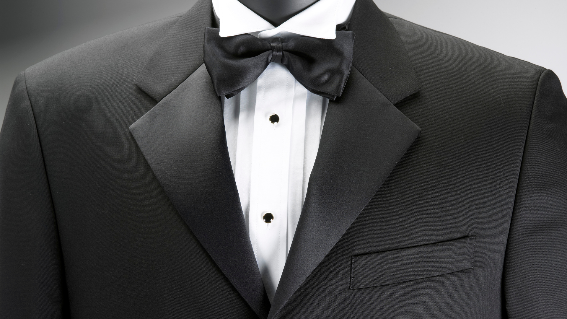 A man in a tuxedo with a bow tie