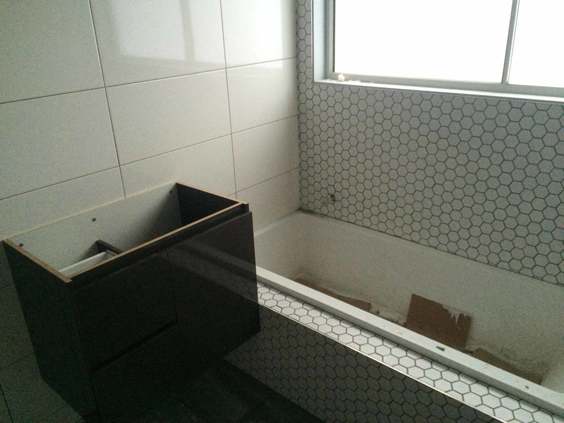 the bathroom and the white tiles