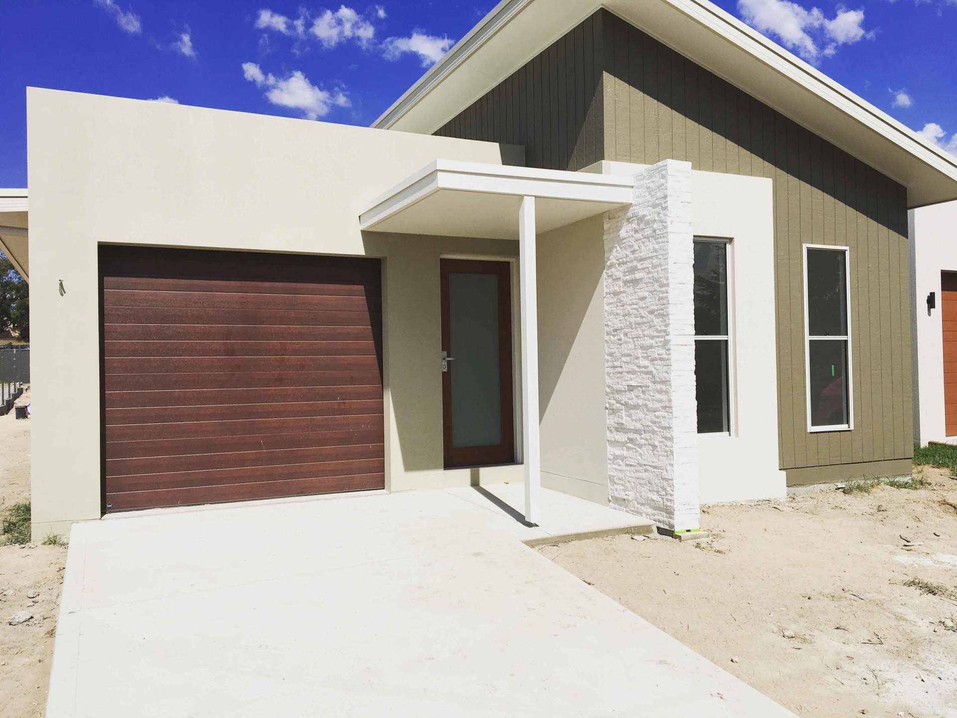 cream colored house and brown