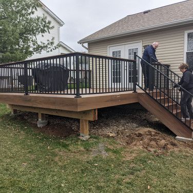 People Are Standing on A Deck — Bridgeton, MO — A+B Acquisitions