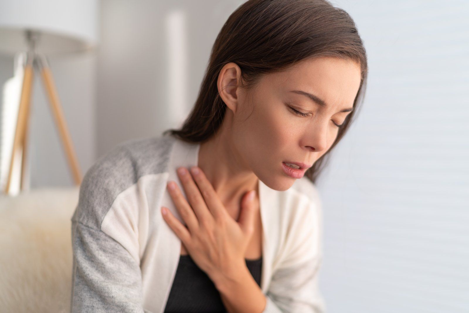 A young woman struggling to breath