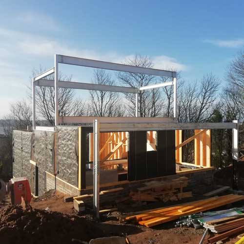 Construction site with metal structure and blue sky