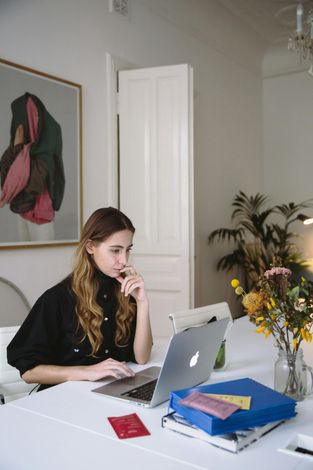 Woman attorney managing ADHD while working on laptop
