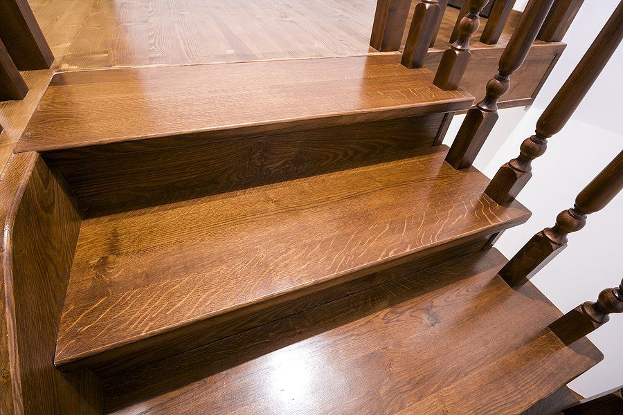 color dark brown wood stair and custom wood stair railing design by Custom Stairs Orlando