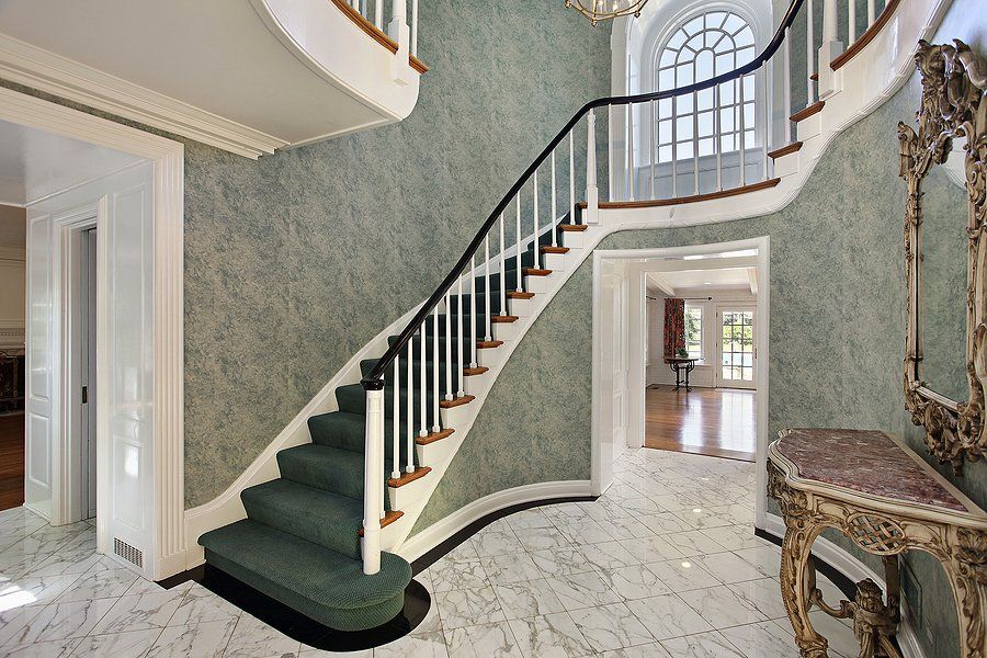modern stair design with gray stair carpet by Custom Stairs Orlando