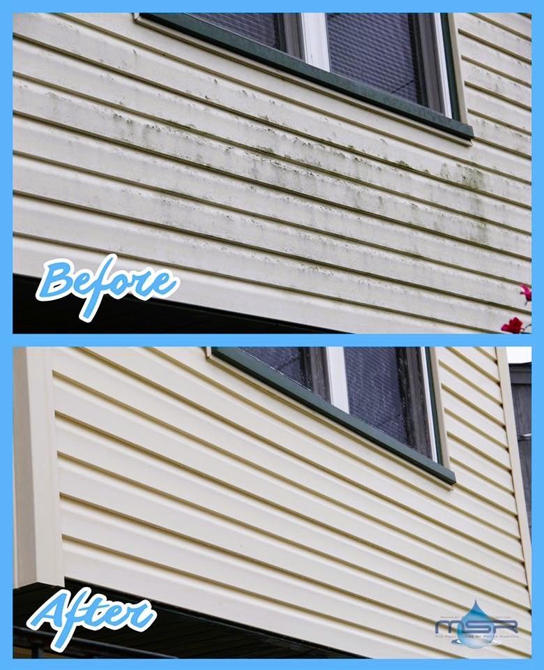 Before-and-after of siding cleaning. Top: dirty siding. Bottom: clean siding. Window and trim are visible.