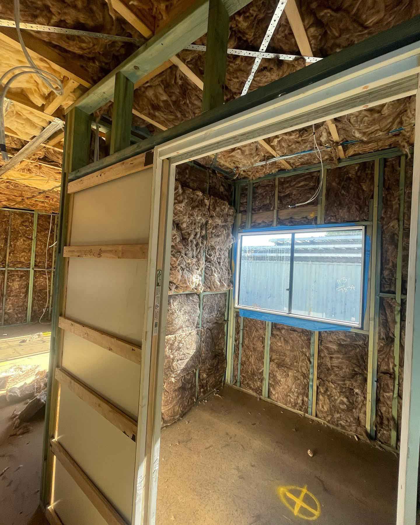 Room in a house under construction with a window — Home Insulation in Kingscliff NSW